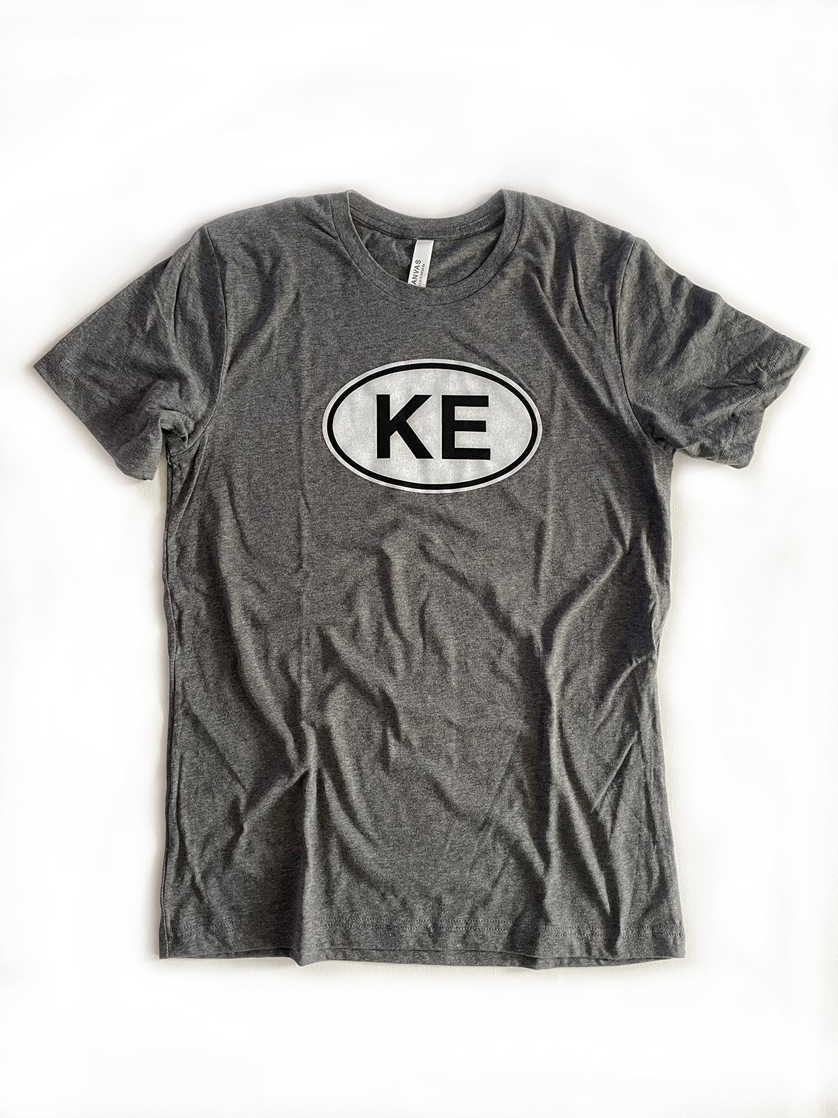 KE oval gray tee